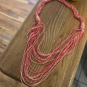 Long beaded coral colored necklace